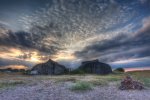 'Lindsfarne Boat Sheds' by Dave Dixon LRPS