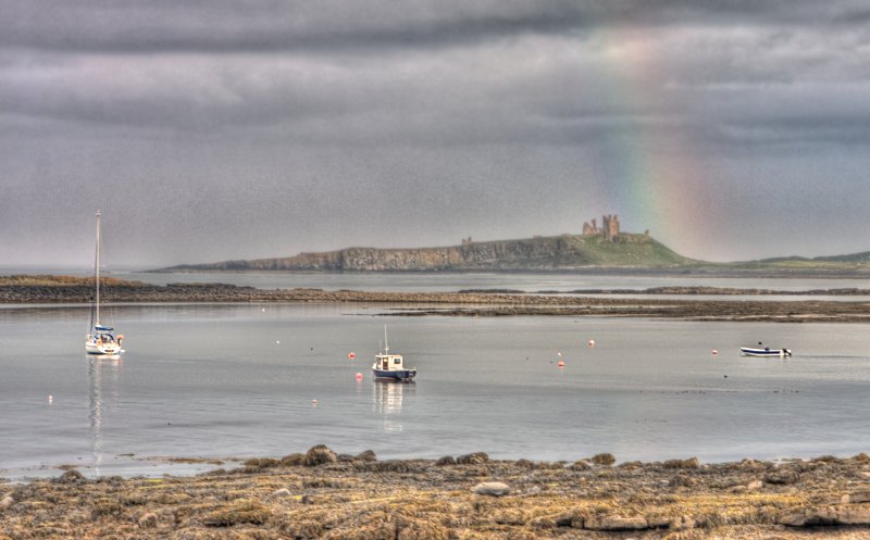 'Rainbow Over Dunstanburgh Castle' by Dave Dixon LRPS